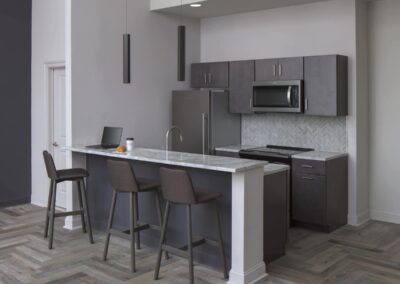 Kitchen with breakfast bar and stainless steel appliances at Philadelphia apartments