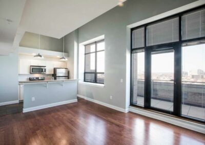 Apartment with hardwood floors and large patio at The Pepper Building