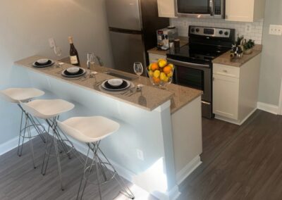 1-bedroom apartment kitchen with a breakfast bar at Korman Residential's The Pepper Building in Philadelphia